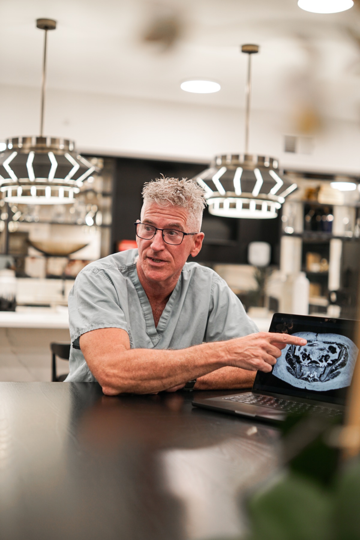Dr. Sean O'Mara pointing at an abdominal MRI scan